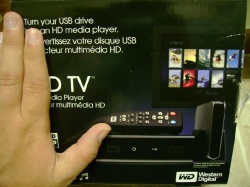 Western Digital HDTV compared to a hand                         